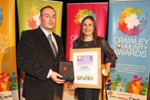DM17311605a.jpg. Crawley Community Awards, 2017. Craig Downs presents the Individual Achievement award to Katie-George Dunlevy. Photo by Derek Martin
